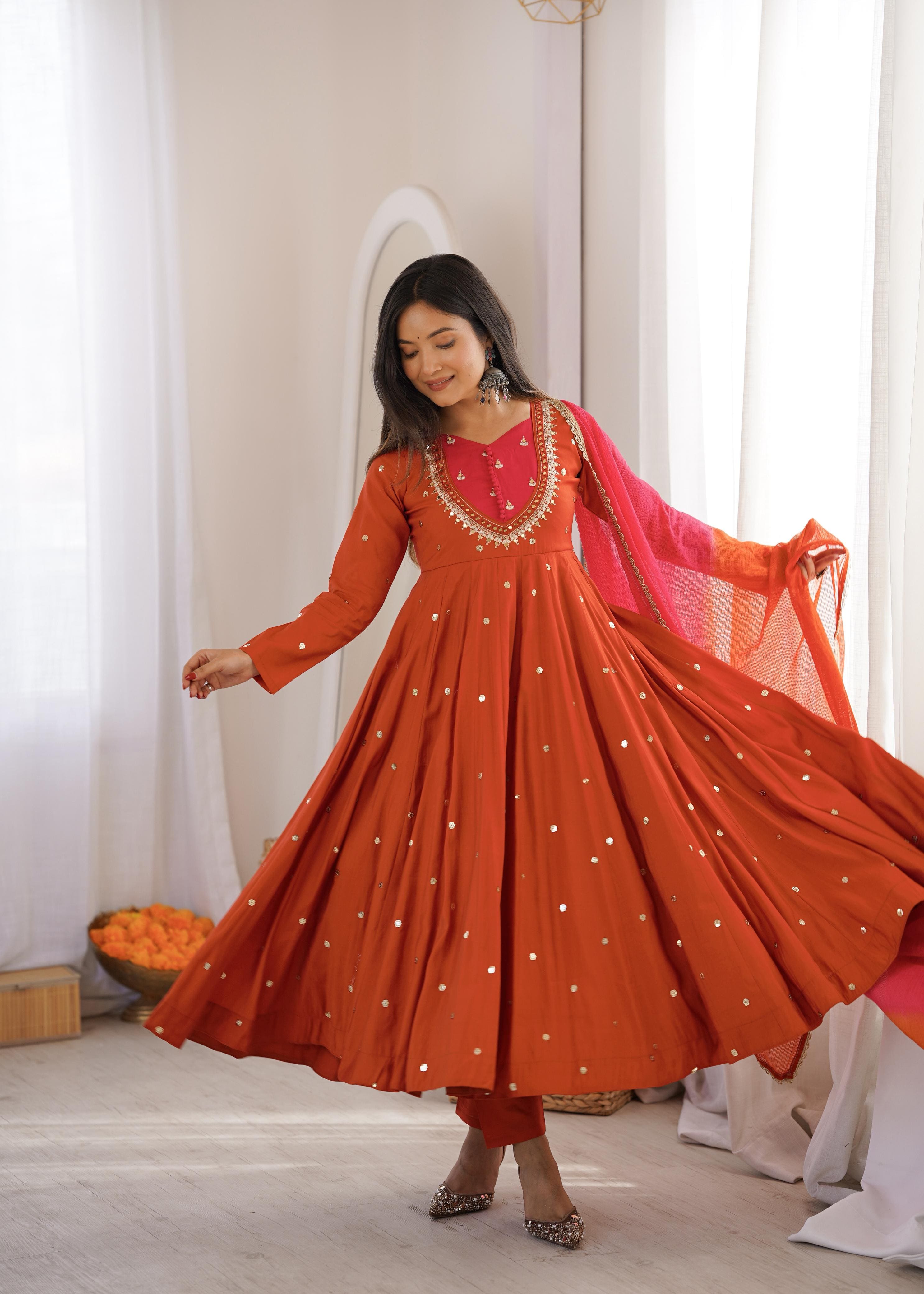 Autumn Orange Roman Silk embroidered mirror work Anarkali suit showcasing elegant flare