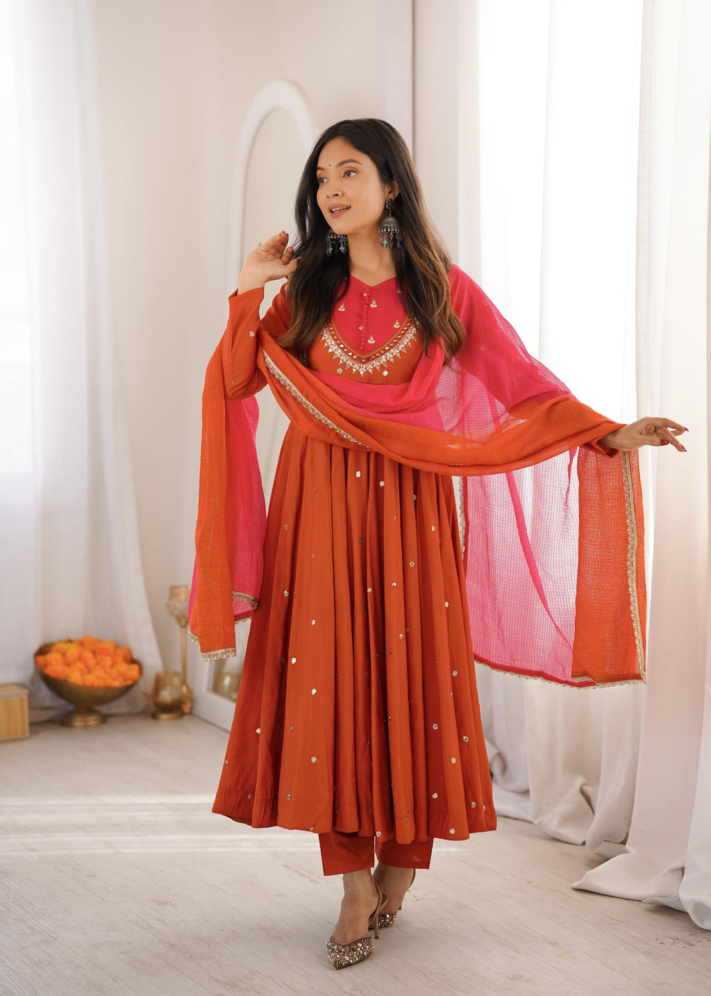 Women's Autumn Orange Roman Silk embroidered mirror work Anarkali suit standing pose with Kota Checks dupatta