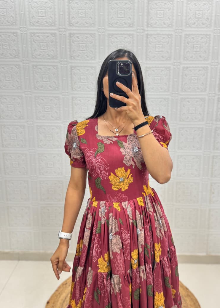 Upper body view of woman wearing Berry Wine Muslin Cotton floral printed maxi dress