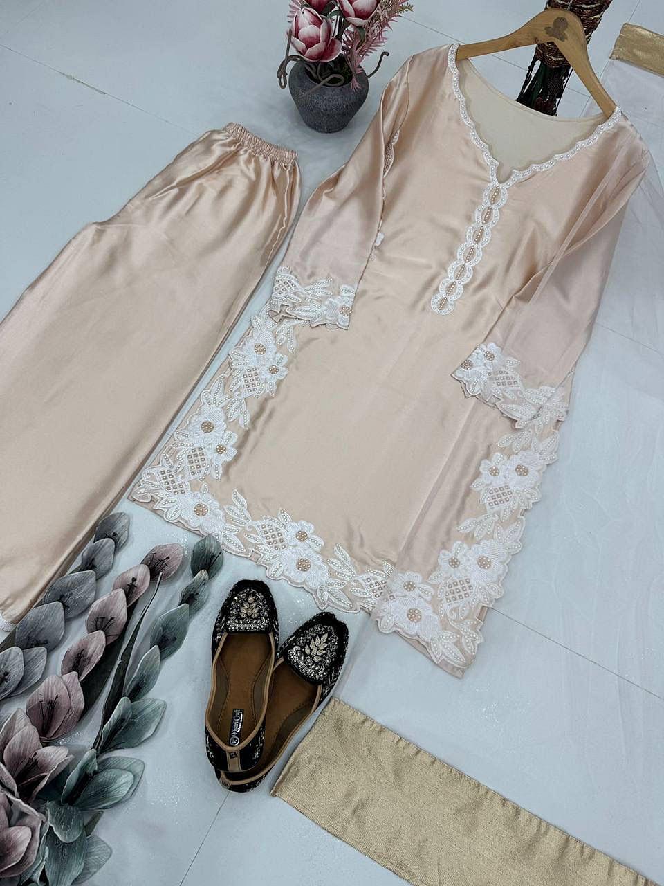 Champagne Beige embroidered palazzo suit set with pearl hand work angled flat lay view
