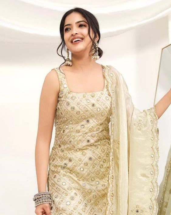 Model wearing Cream Gold embroidered palazzo suit set close-up portrait view