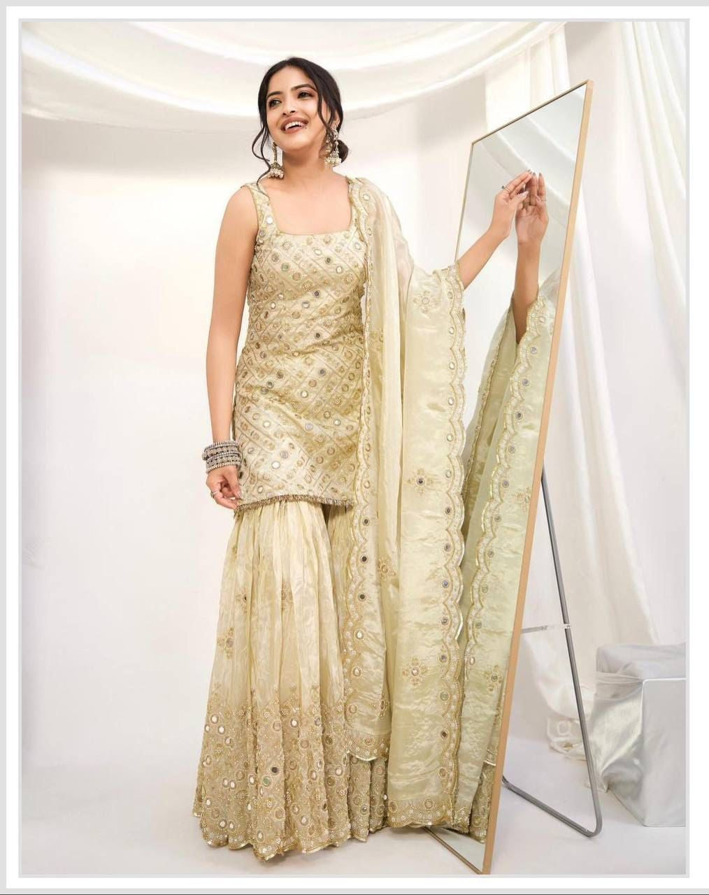 Model wearing Cream Gold natural crape embroidered palazzo suit set with matching dupatta