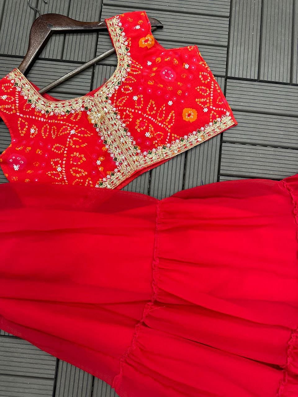 Crimson Red shrug lehenga set featuring embroidered blouse and flared lehenga