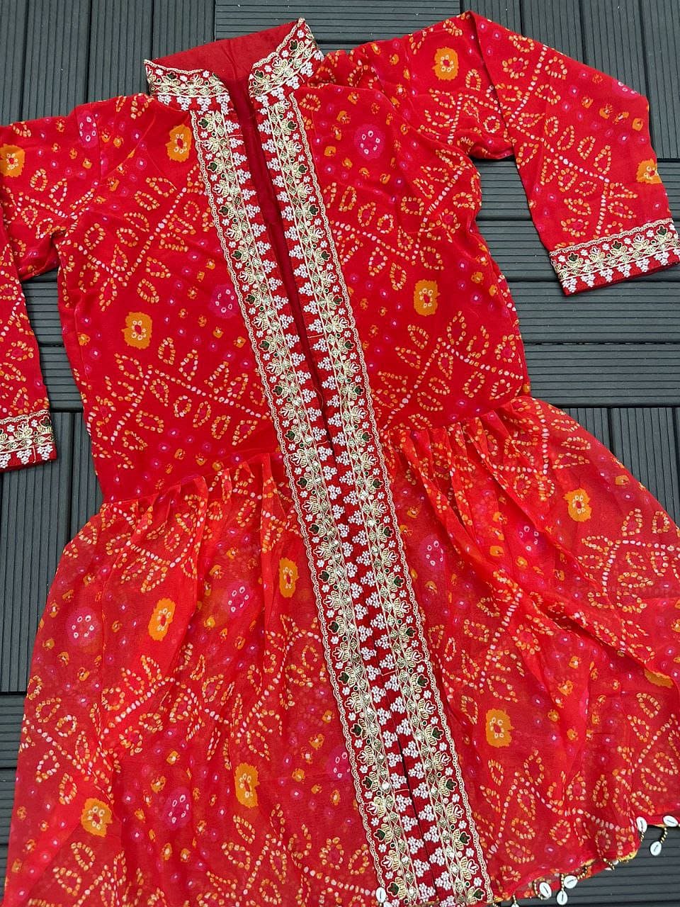 Crimson Red shrug lehenga set flat lay with embroidered shrug and lehenga