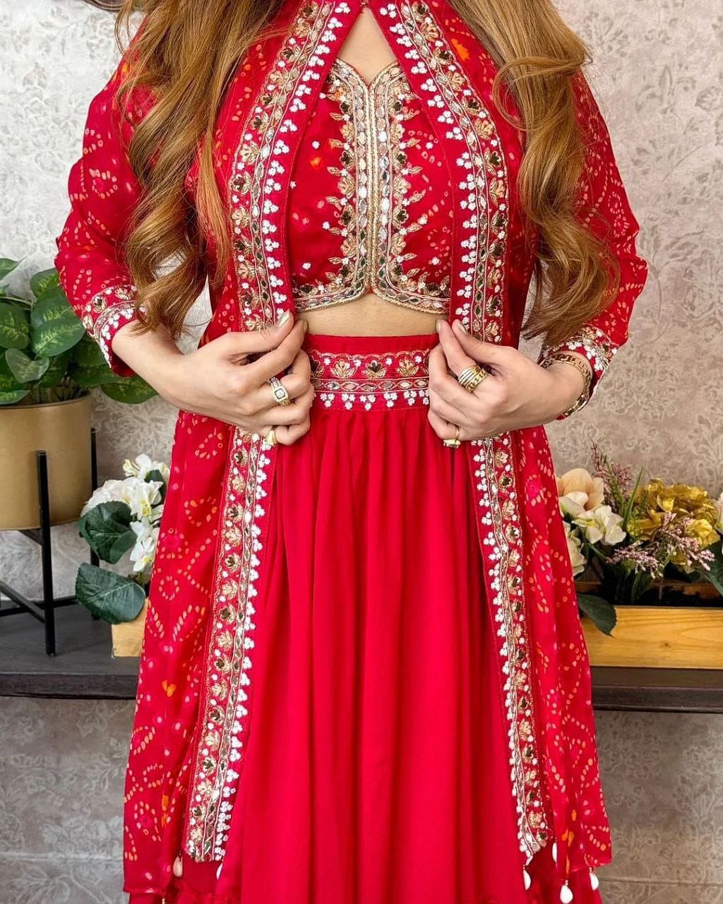 Model wearing Crimson Red shrug lehenga set with embroidered blouse and shrug