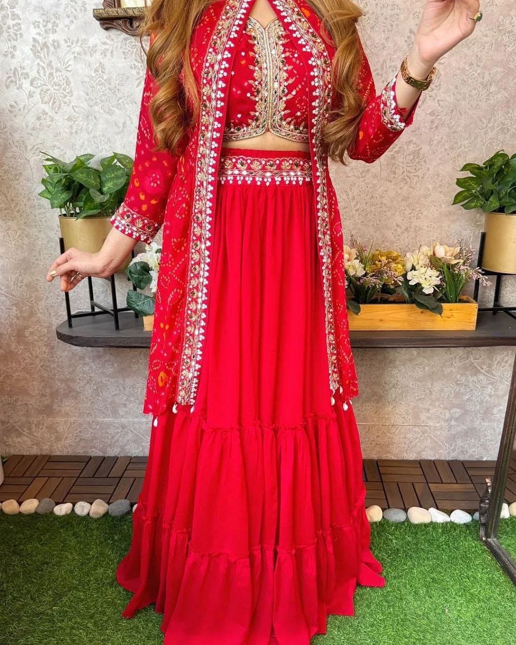 Full-length view of Crimson Red shrug lehenga set with embroidered shrug