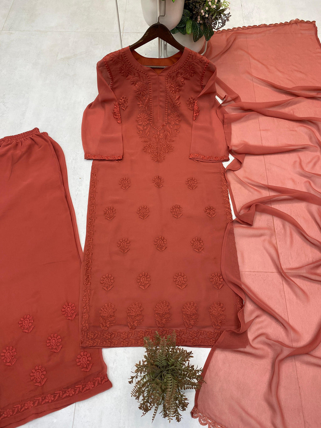 Rust brown faux georgette embroidered palazzo suit set with dupatta flat lay