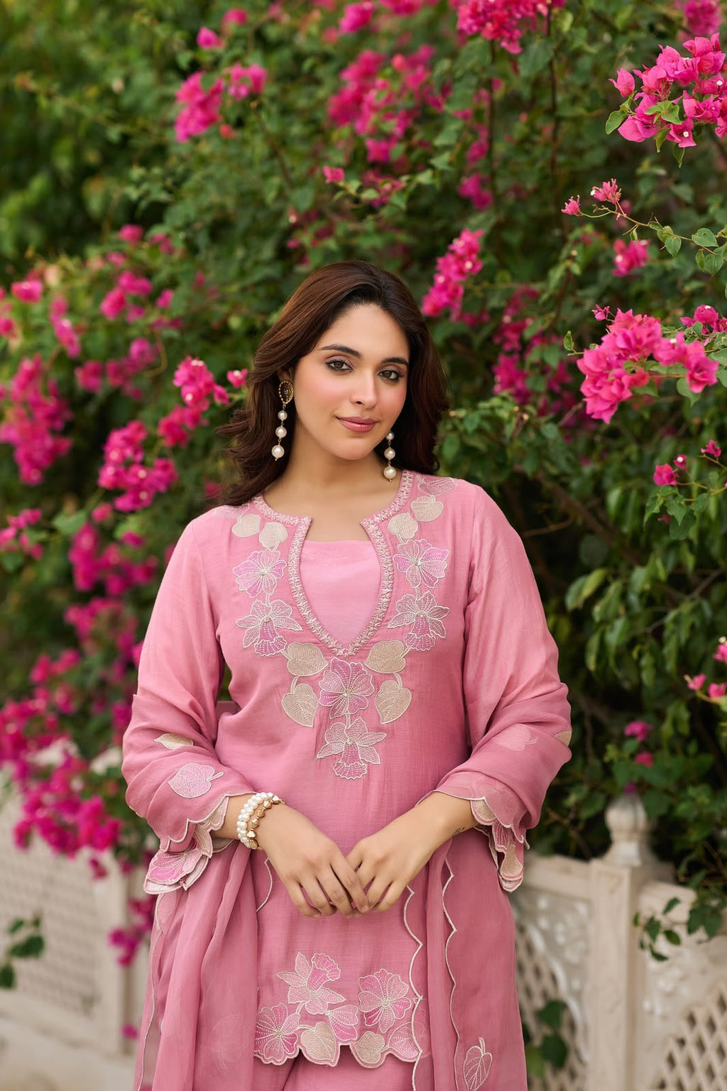Three-quarter portrait of Dusty Rose Natural Satin embroidered sharara suit showcasing floral embroidery