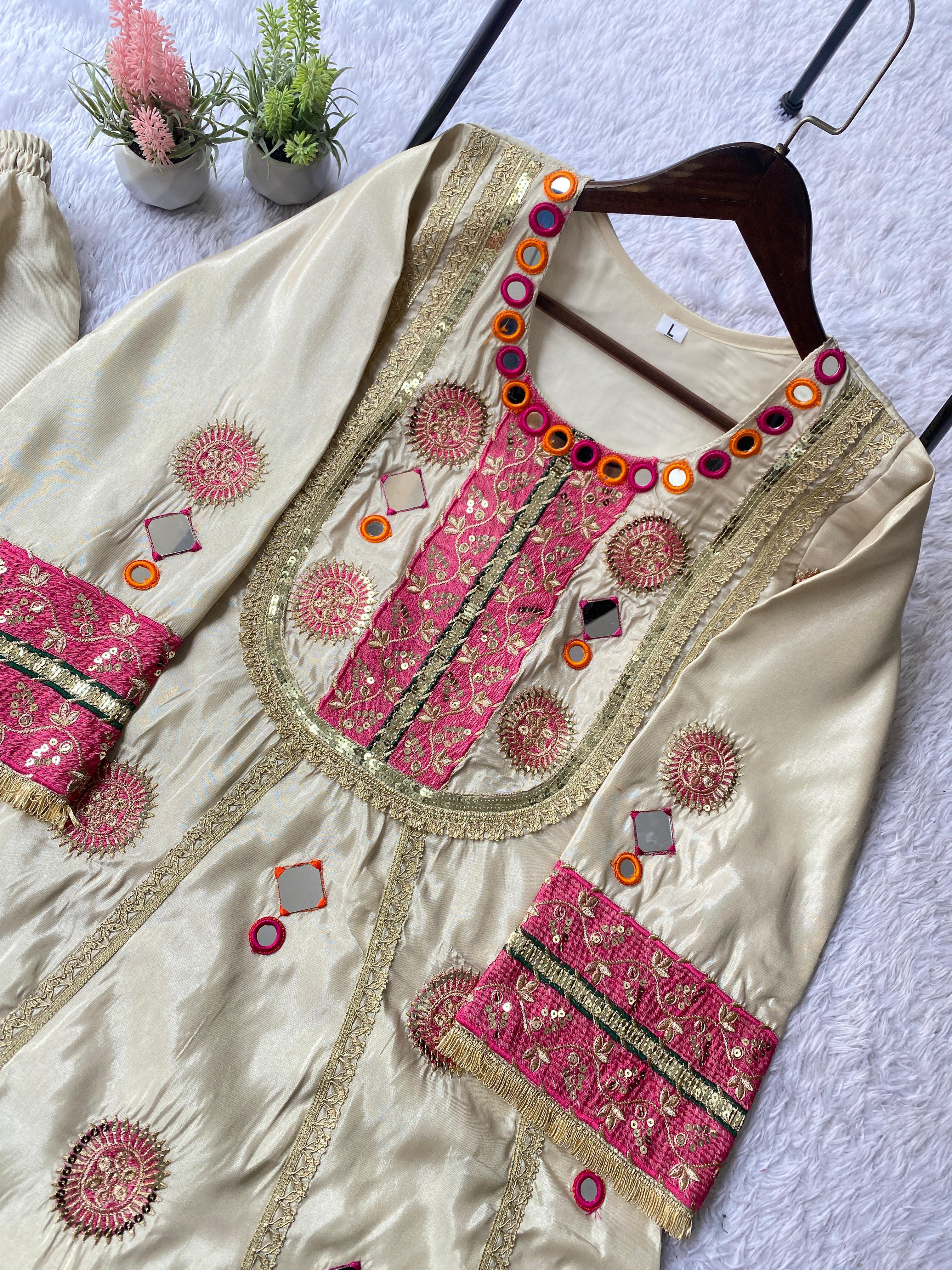 Close-up of Ivory Cream Cos Moss co-ord set featuring mirror and sequence embroidery details