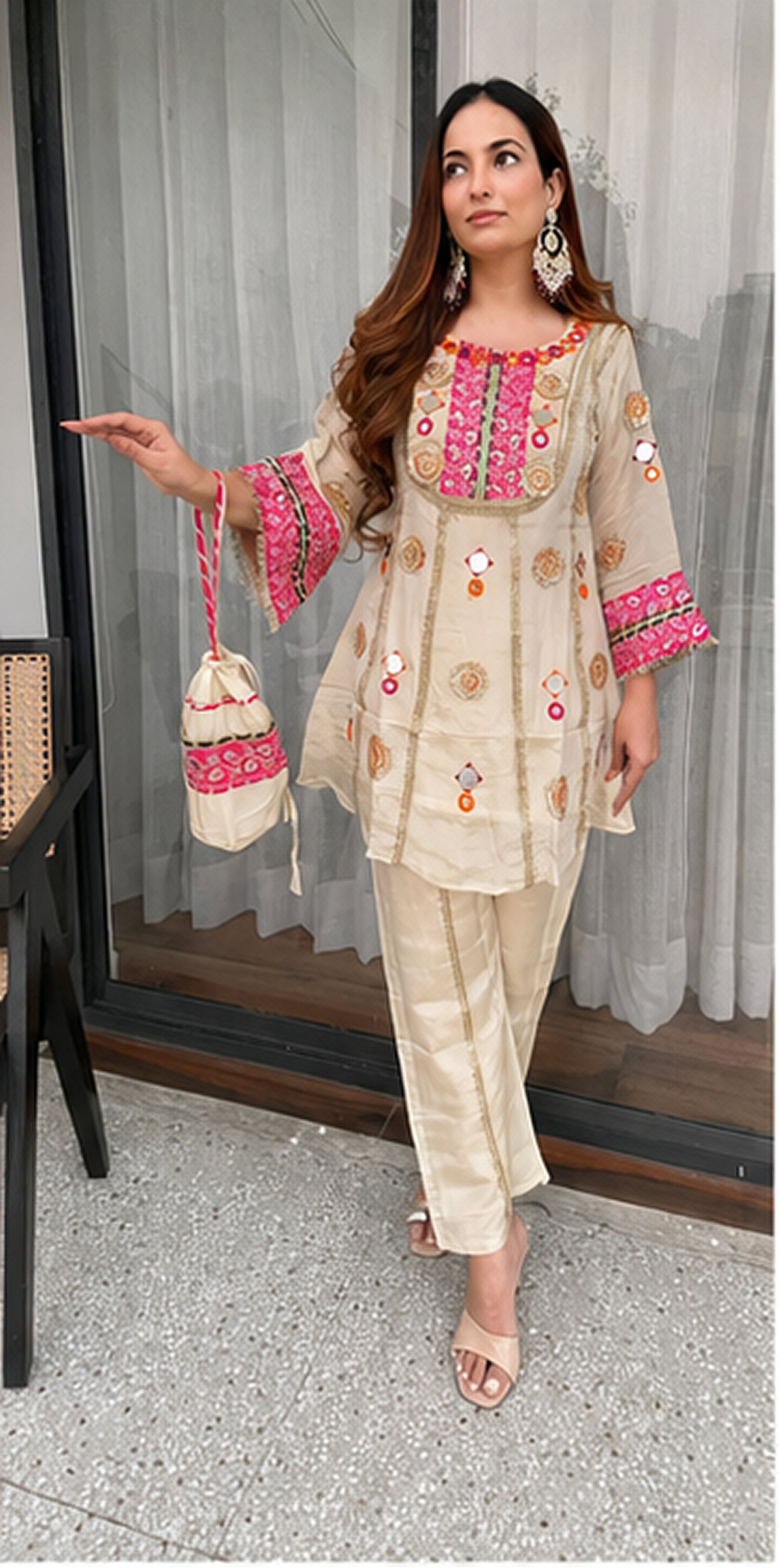 Woman wearing Ivory Cream Cos Moss mirror and sequence embroidered co-ord set with matching palazzo front view