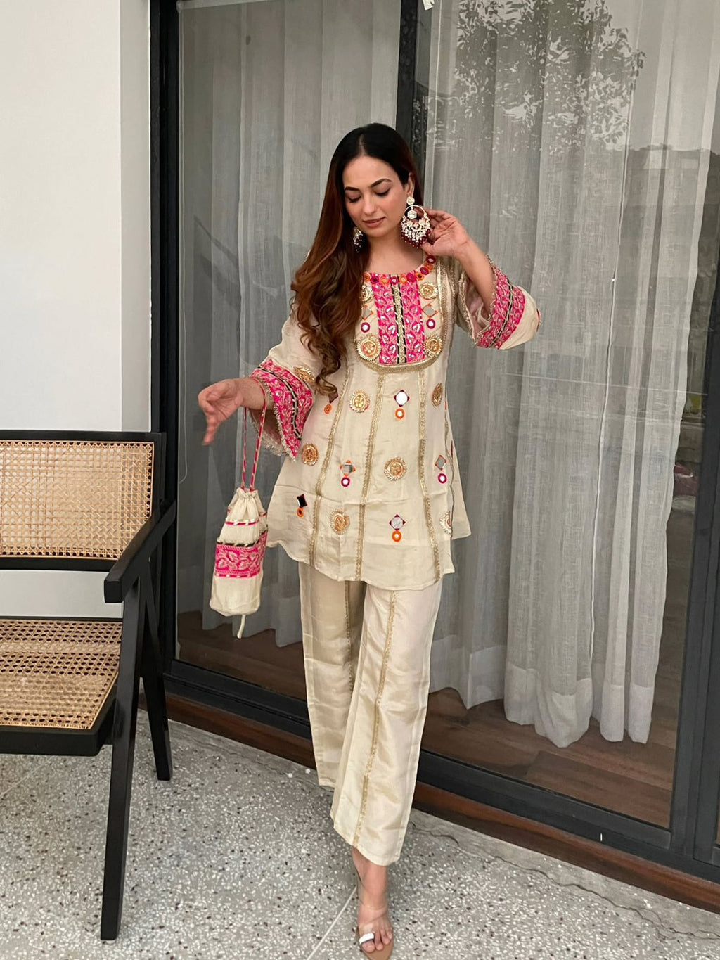 Model wearing Ivory Cream Cos Moss embroidered co-ord set with matching palazzo