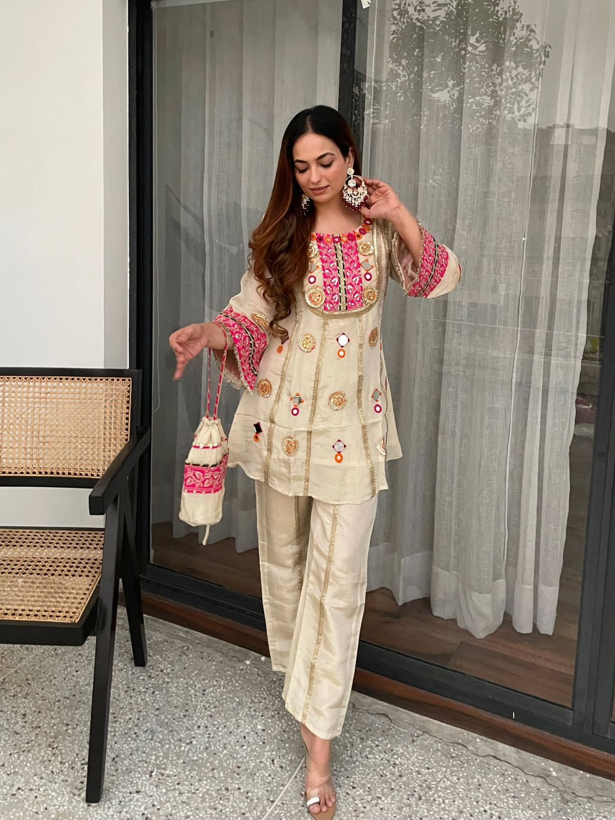 Model wearing Ivory Cream Cos Moss embroidered co-ord set with matching palazzo