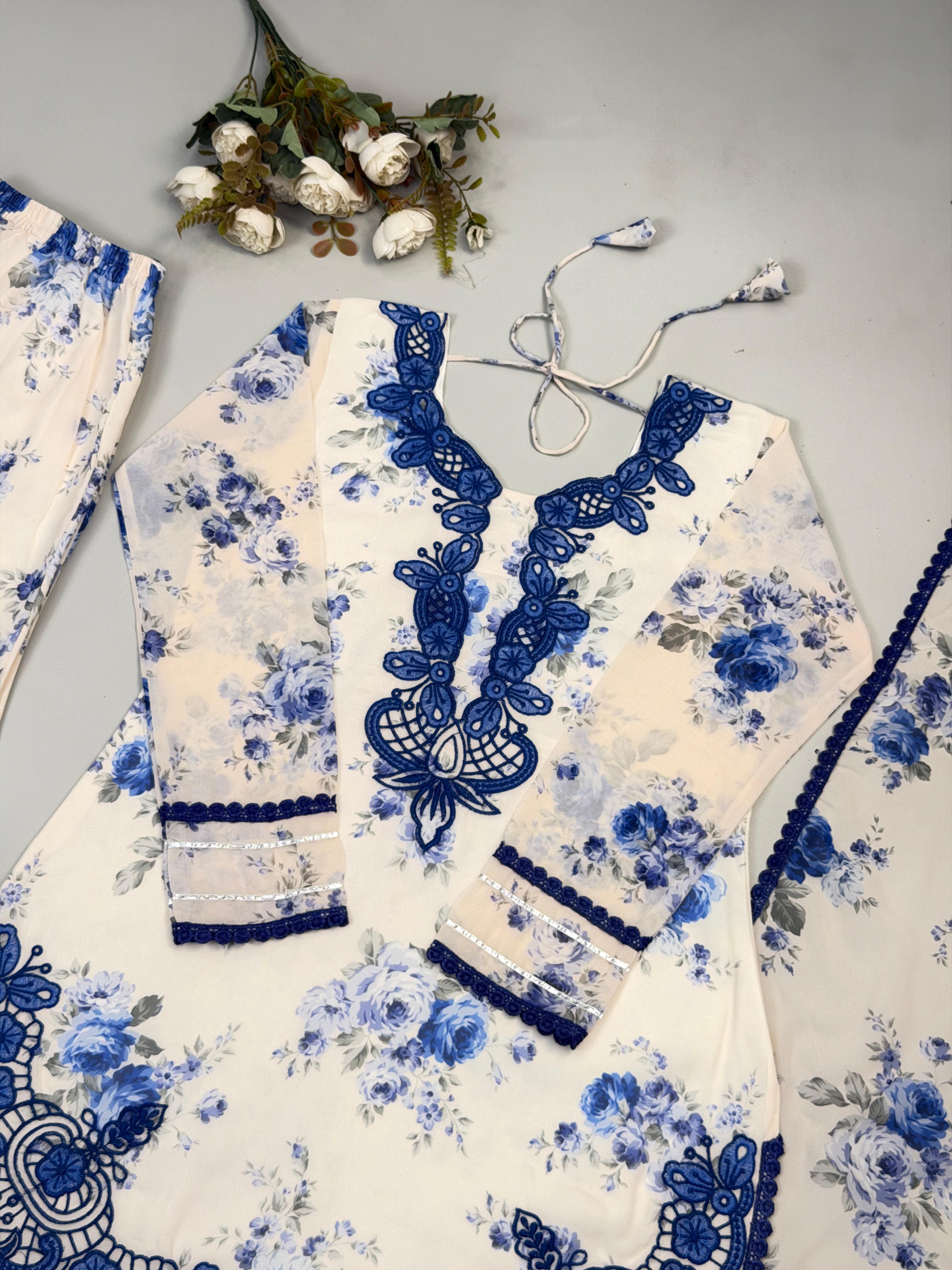 Close-up of Ivory Cream Heavy Faux Georgette kurta neckline featuring royal blue embroidery work