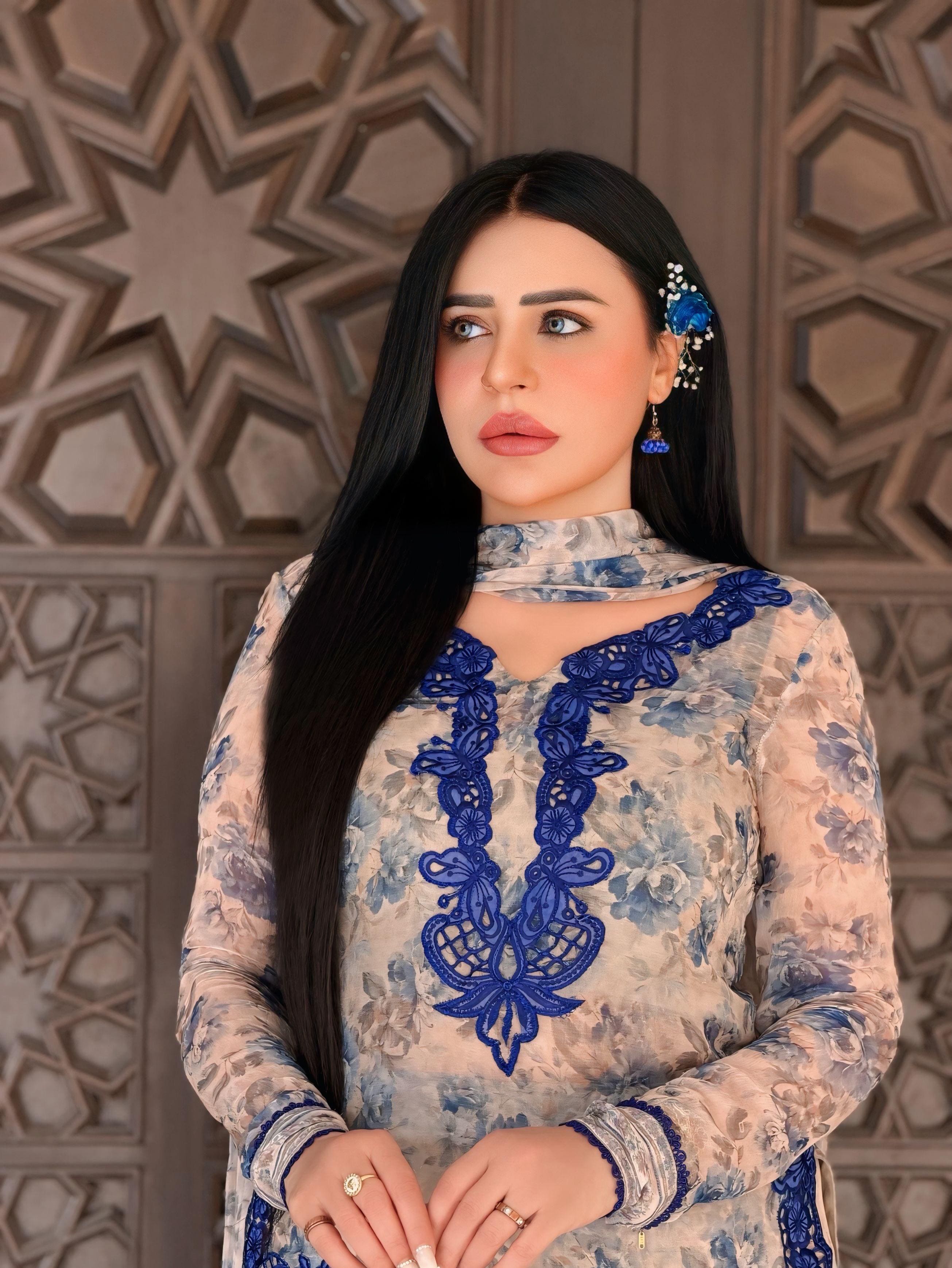 Close-up portrait of Women's Ivory Cream Heavy Faux Georgette embroidered palazzo suit featuring royal blue embroidery and digital print