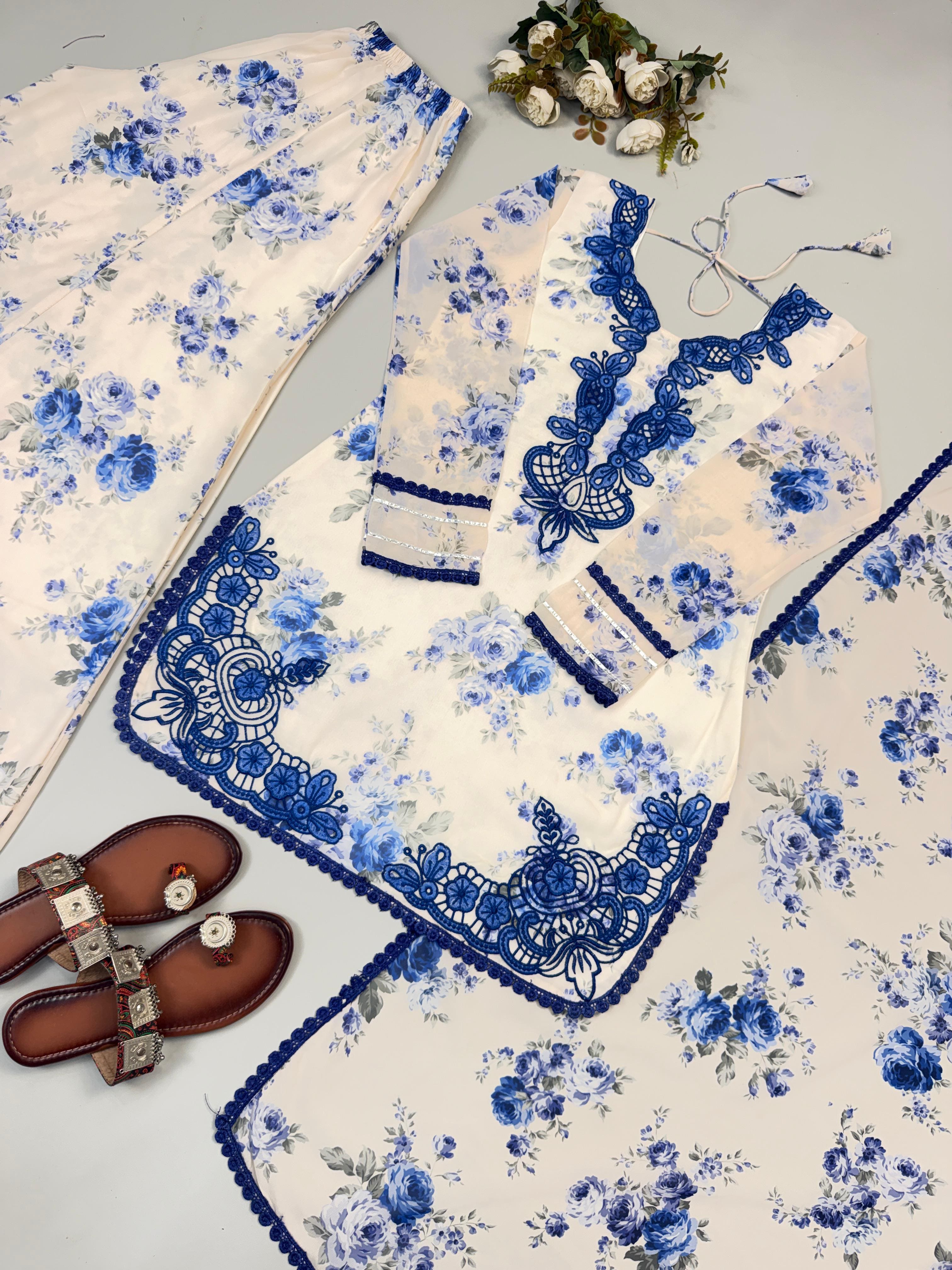Complete Ivory Cream Heavy Faux Georgette embroidered palazzo suit set with digital print displayed in flat lay