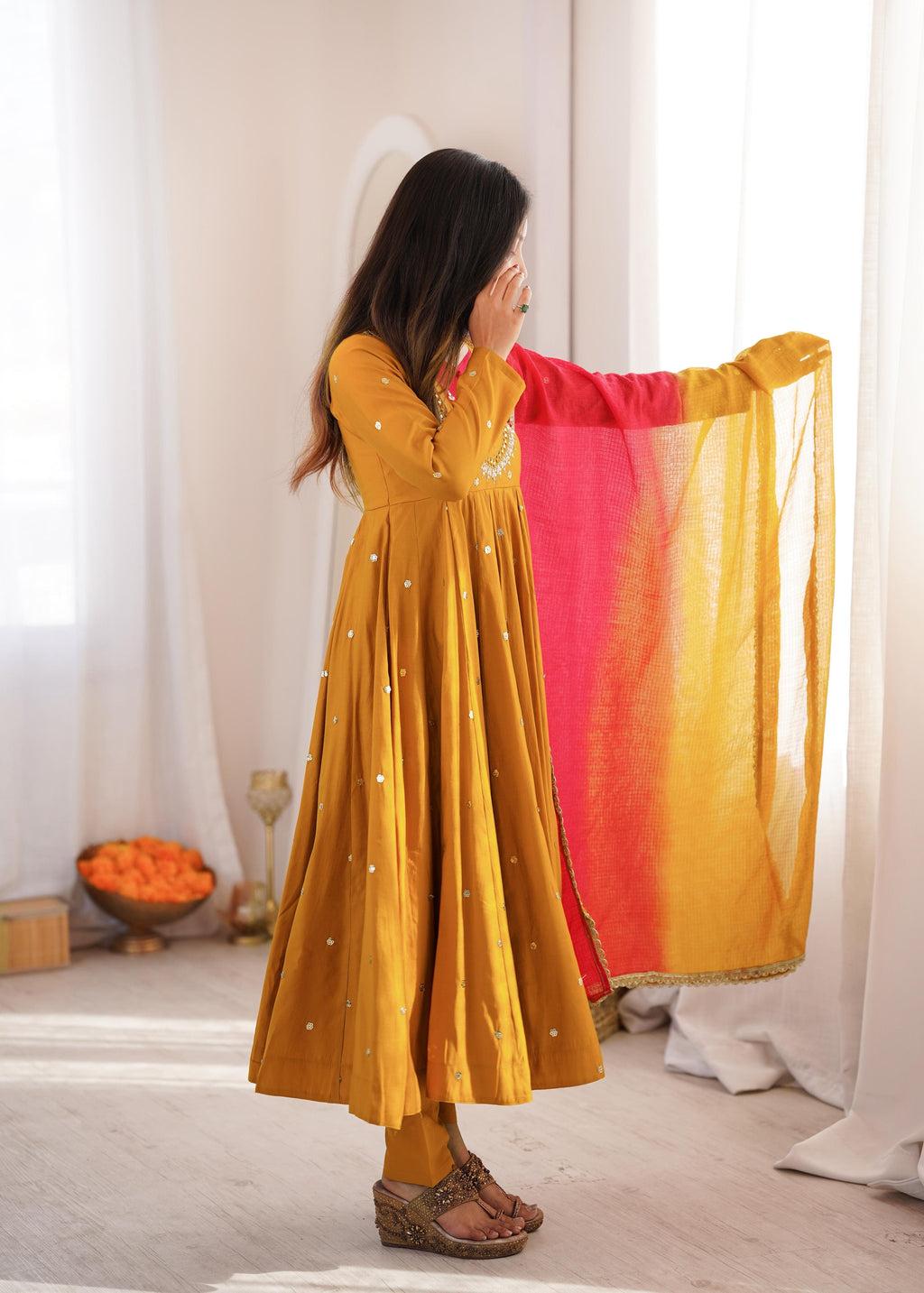 Rear angle view of Mustard Gold Roman Silk embroidered Anarkali suit with Kota Checks dupatta