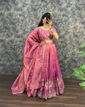 Model wearing Orchid Pink tissue cotton lehenga choli with embroidered dupatta full front view