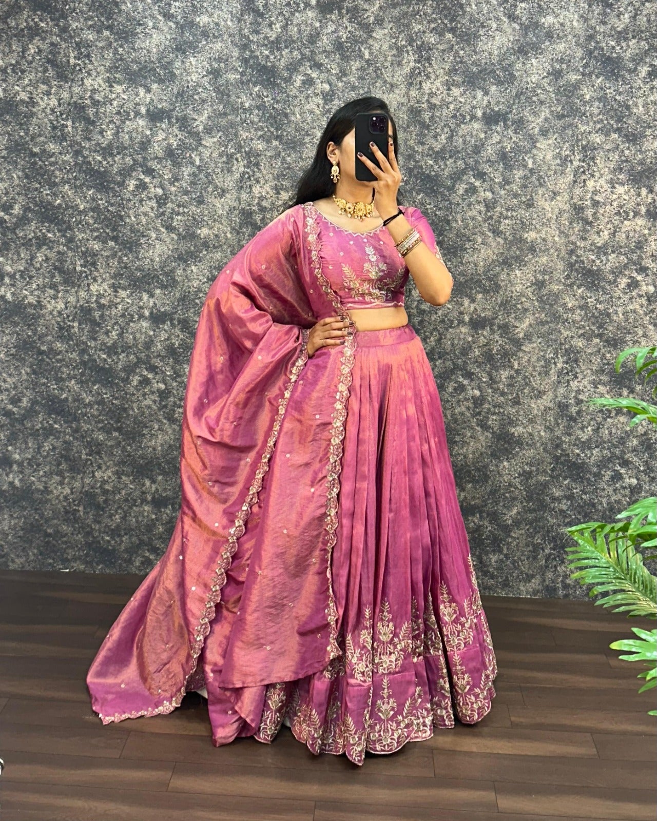 Model wearing Orchid Pink tissue cotton lehenga choli with embroidered dupatta full front view