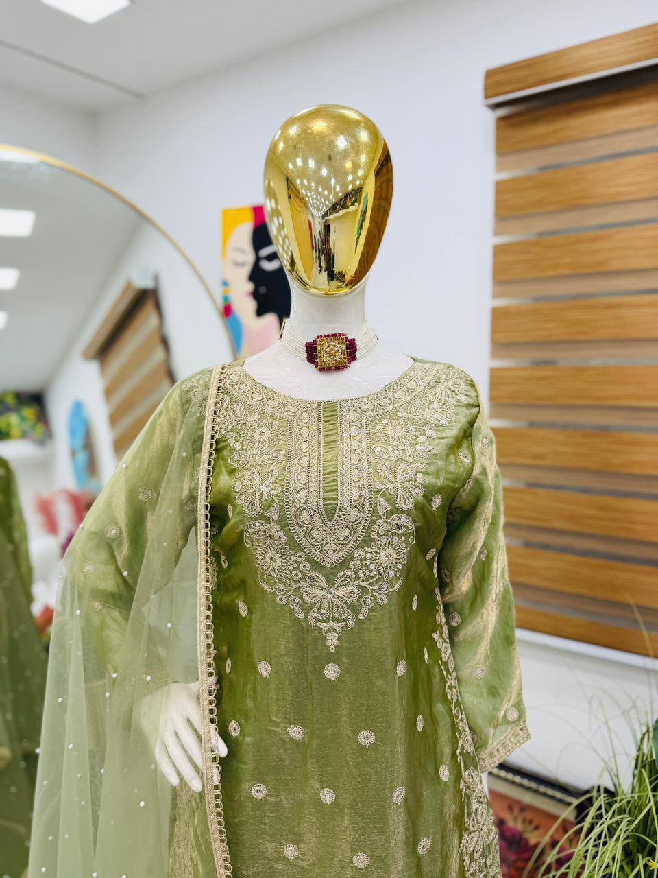 Pistachio Green Designer Fandy Silk embroidered palazzo suit displayed on mannequin