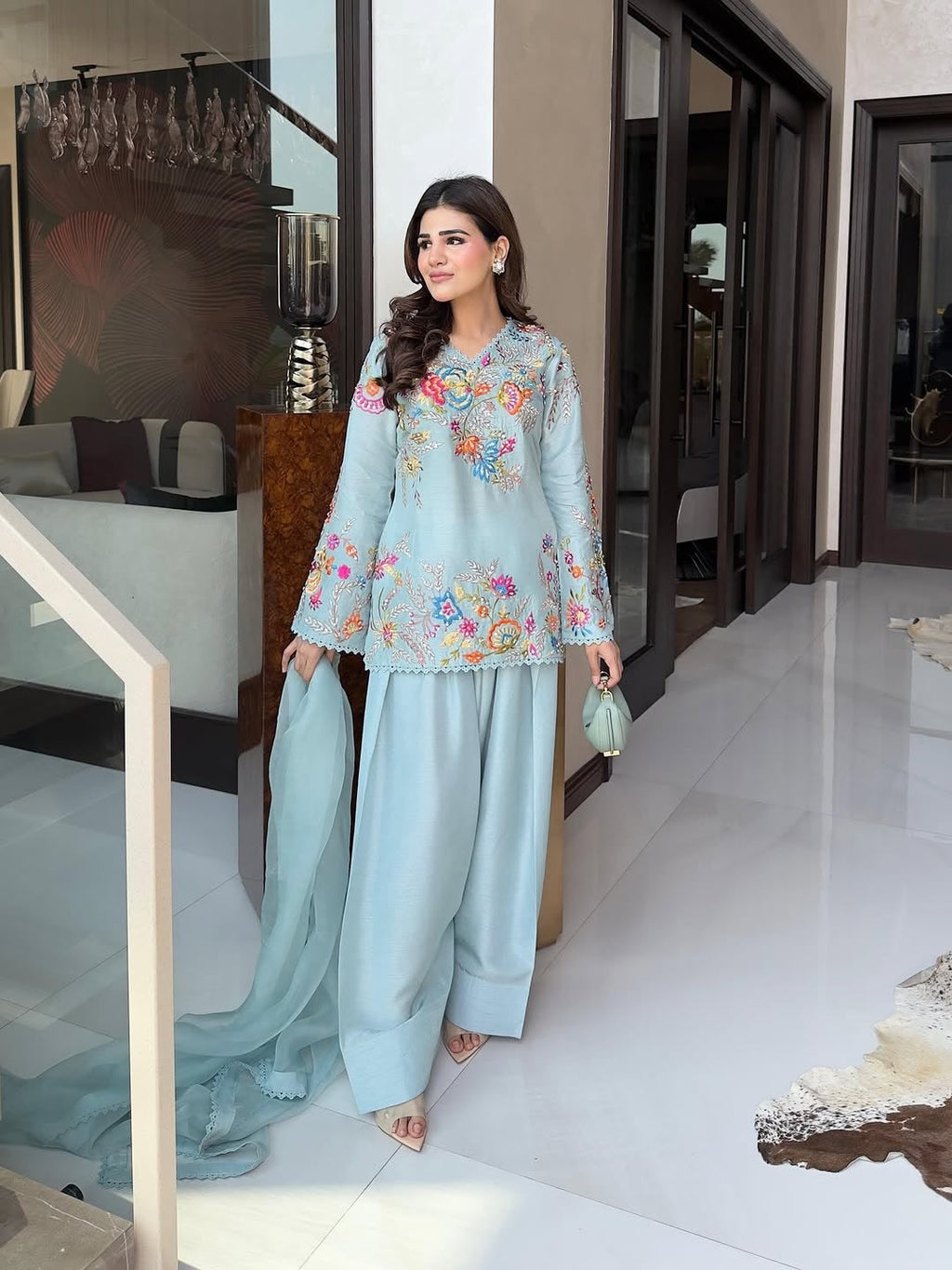 Model wearing Powder Blue floral embroidered farsi salwar suit with dupatta