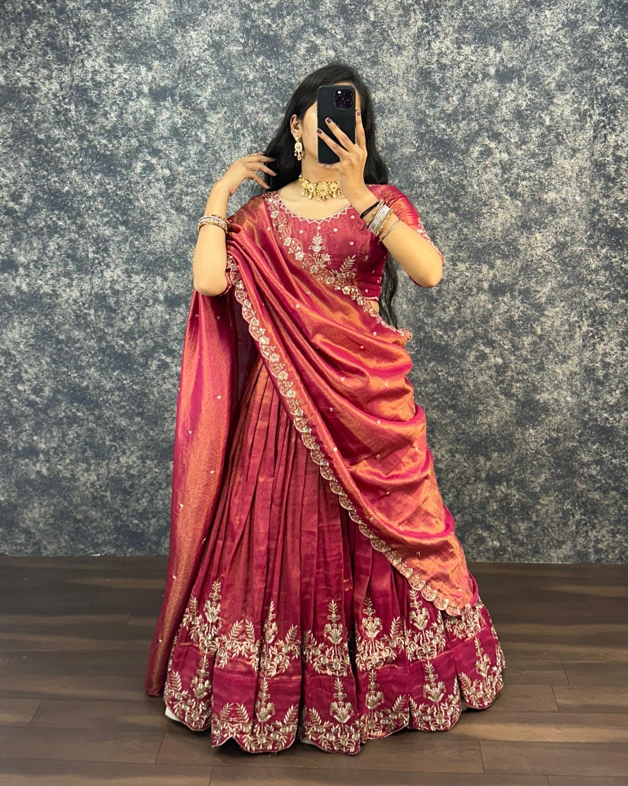 Model wearing Rani Rose Pink tissue cotton lehenga choli with embroidered cutwork dupatta front view
