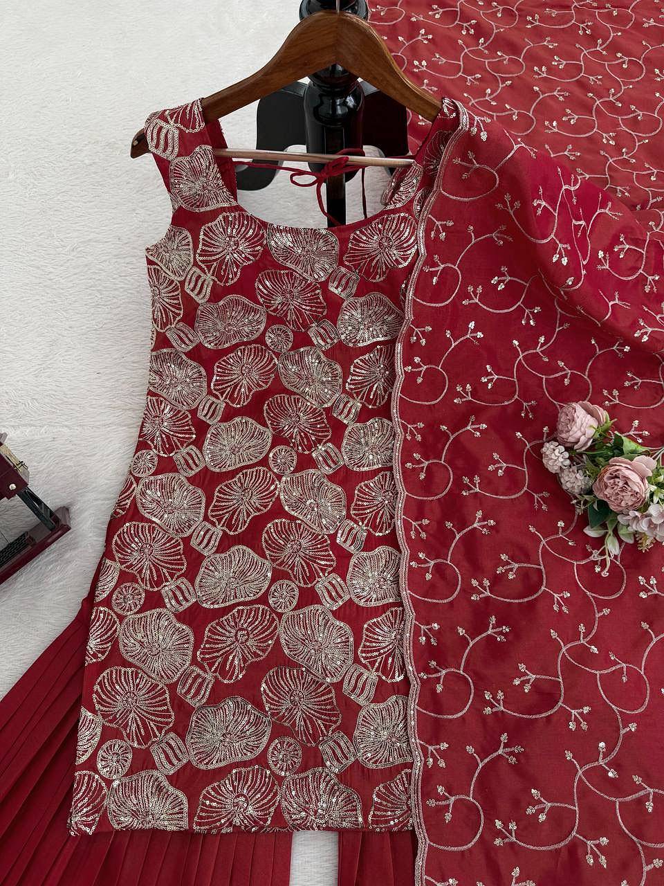 Red embroidered kurti sharara set with matching dupatta flat lay