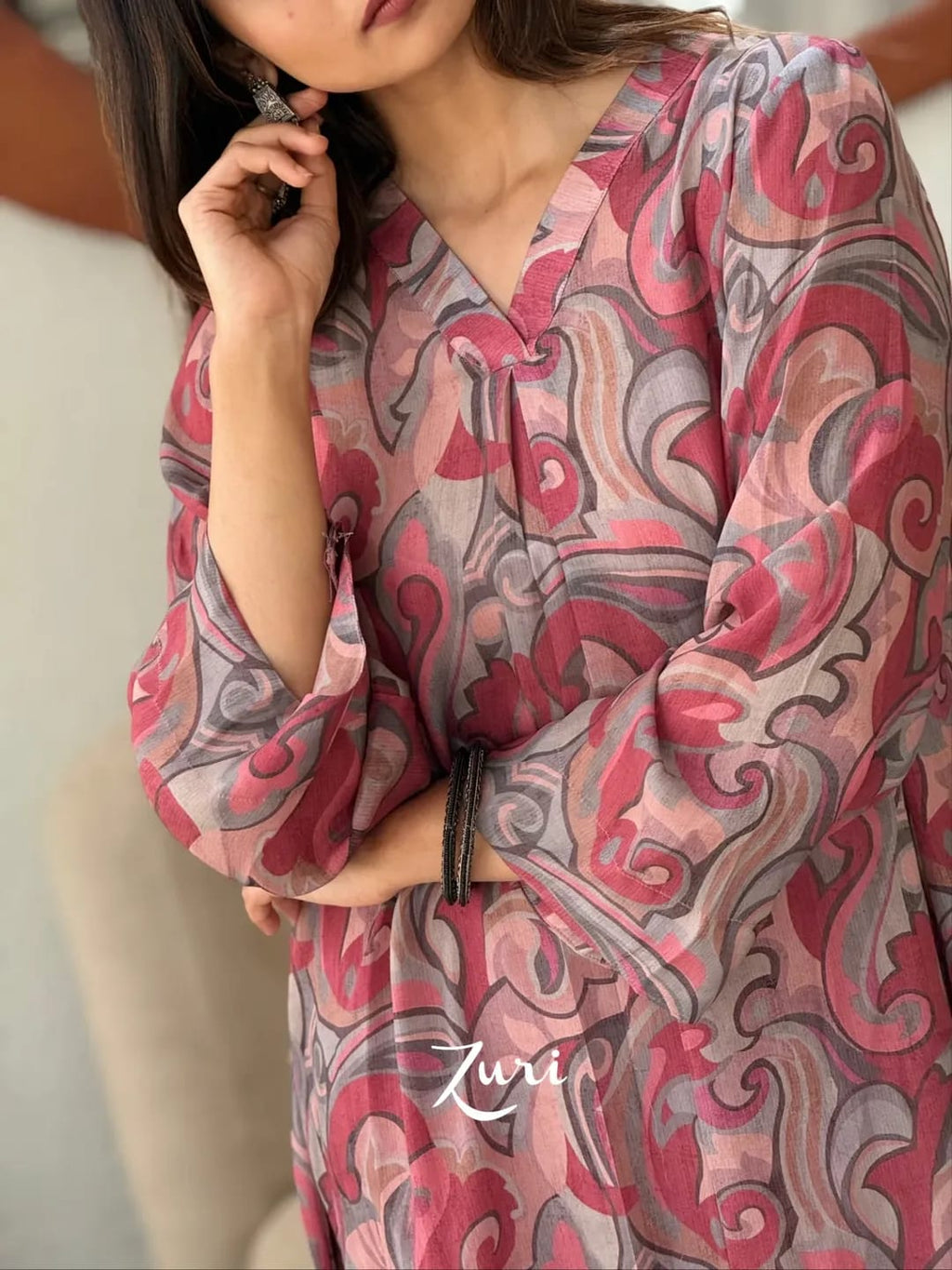 Close-up of Rose Pink Softy Premium Chiffon Silk abstract print Anarkali gown showing V-neck and sleeves