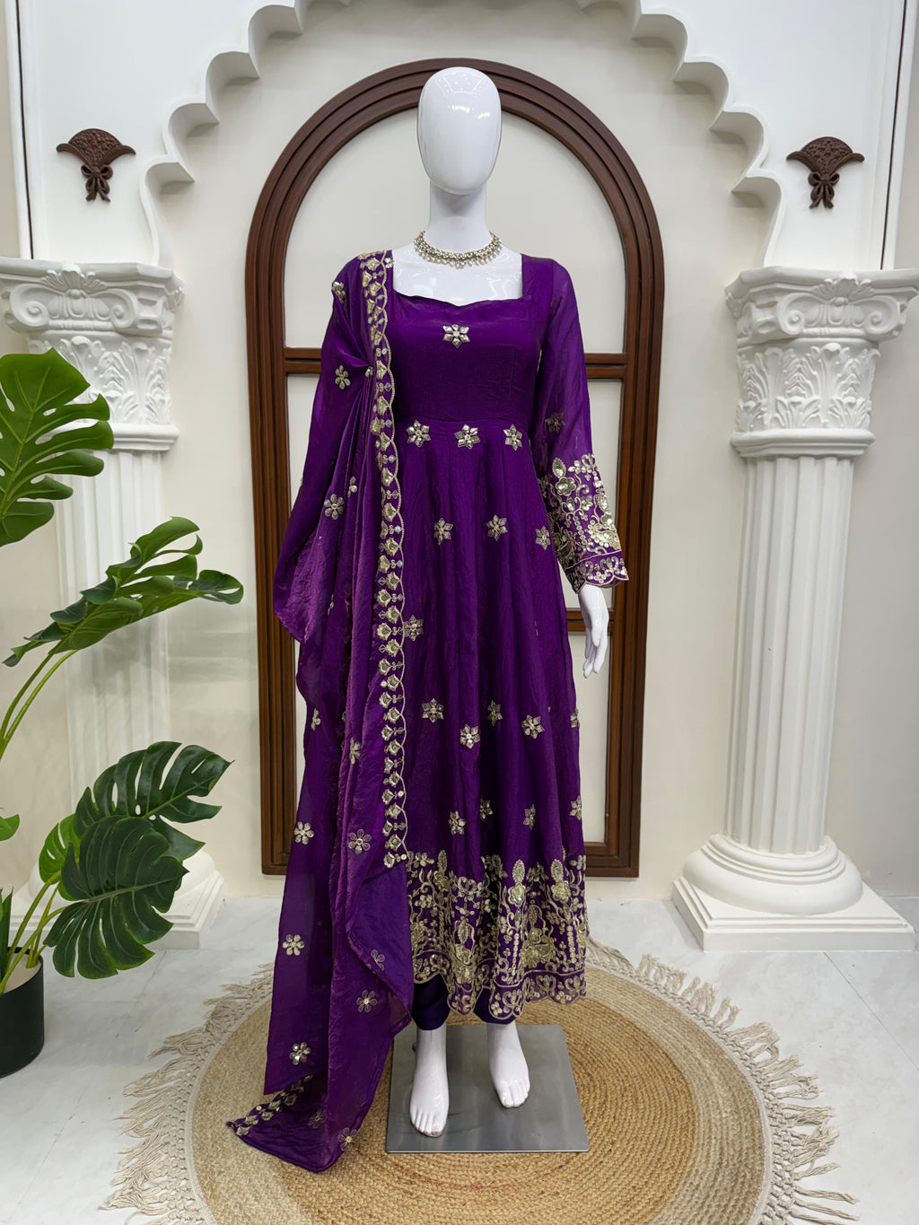 Royal Purple embroidered Fendy silk Anarkali suit displayed on mannequin