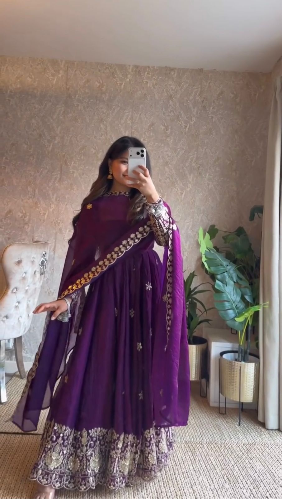 Woman posing in Royal Purple embroidered Fendy silk Anarkali suit