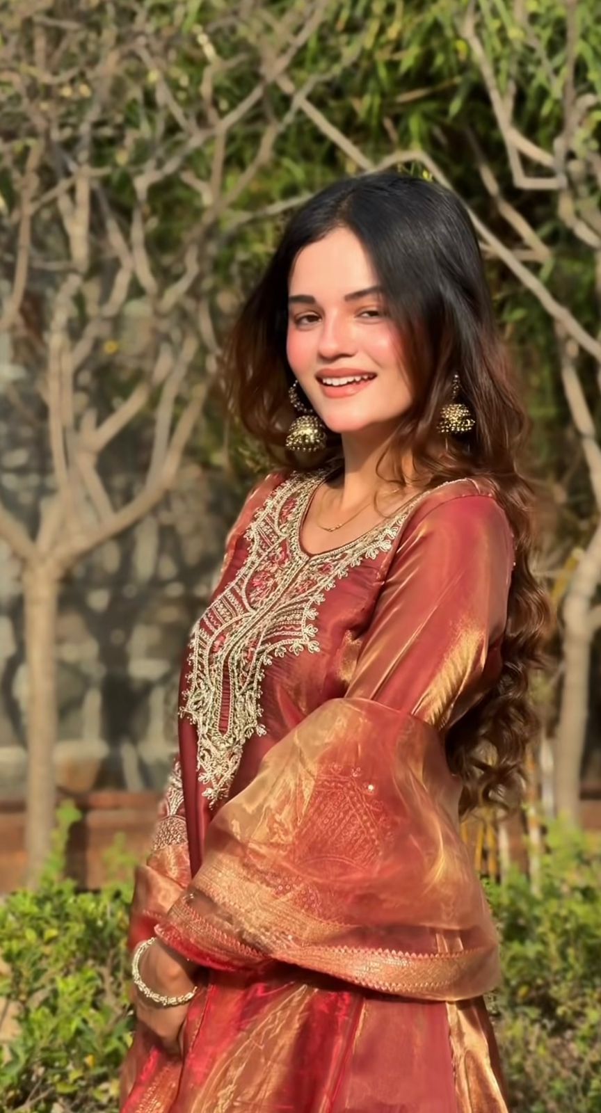 Portrait view of rust brown embroidered kurti and dupatta