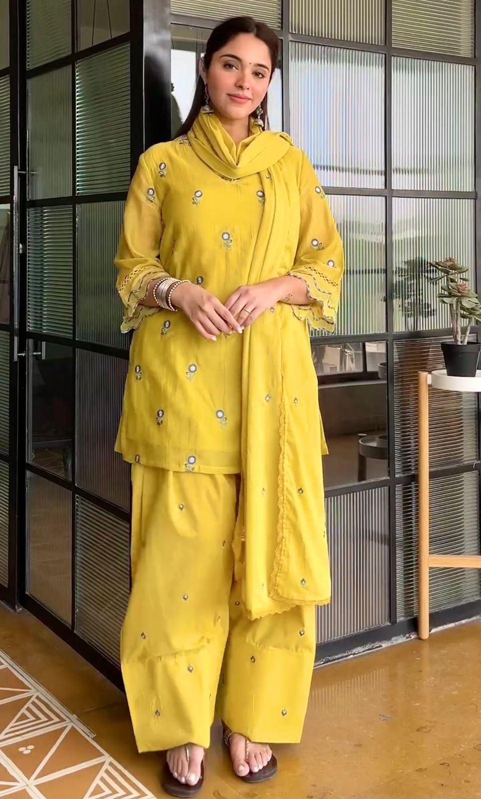 Woman wearing Sunshine Yellow embroidered Farshi Palazzo suit in classic front pose