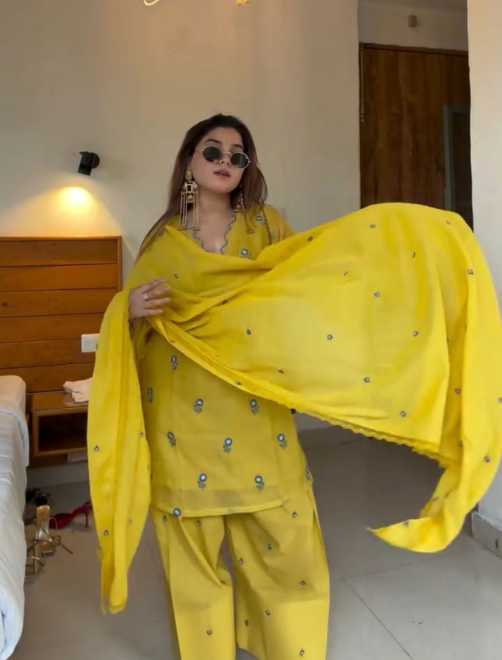 Woman wearing Sunshine Yellow embroidered Farshi Palazzo suit displaying matching embroidered dupatta
