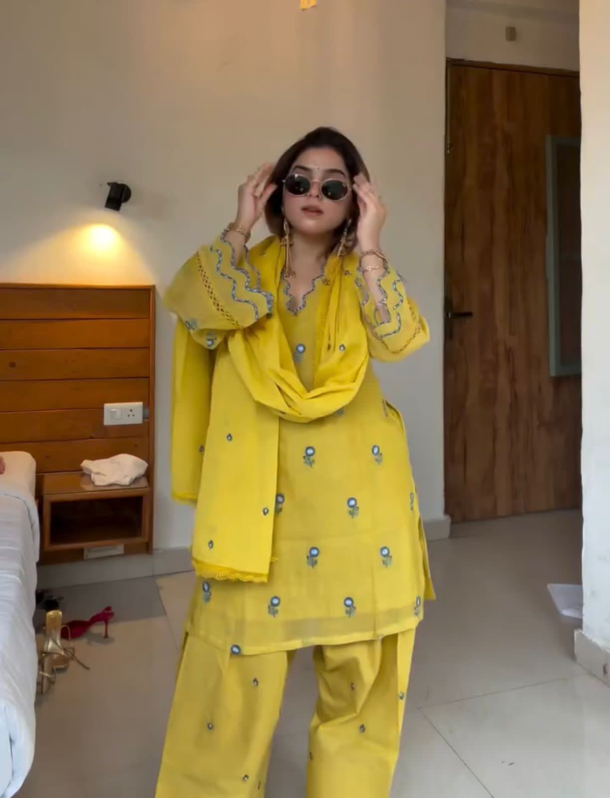 Full-length portrait of woman wearing Sunshine Yellow embroidered Farshi Palazzo suit