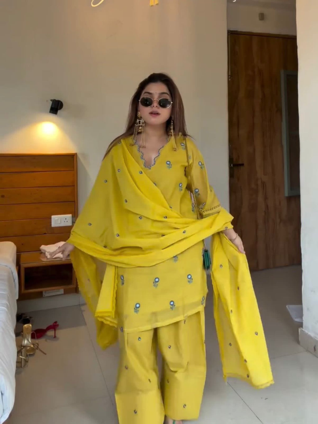 Model wearing Sunshine Yellow Mul Chandheri embroidered Farshi Palazzo suit with dupatta