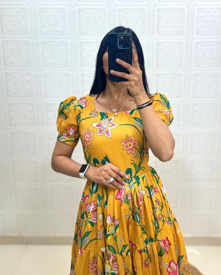 Close-up view of Sunshine Yellow Muslin Cotton floral printed puff sleeve dress