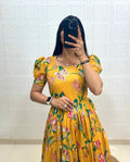 Close-up view of Sunshine Yellow Muslin Cotton floral printed puff sleeve dress