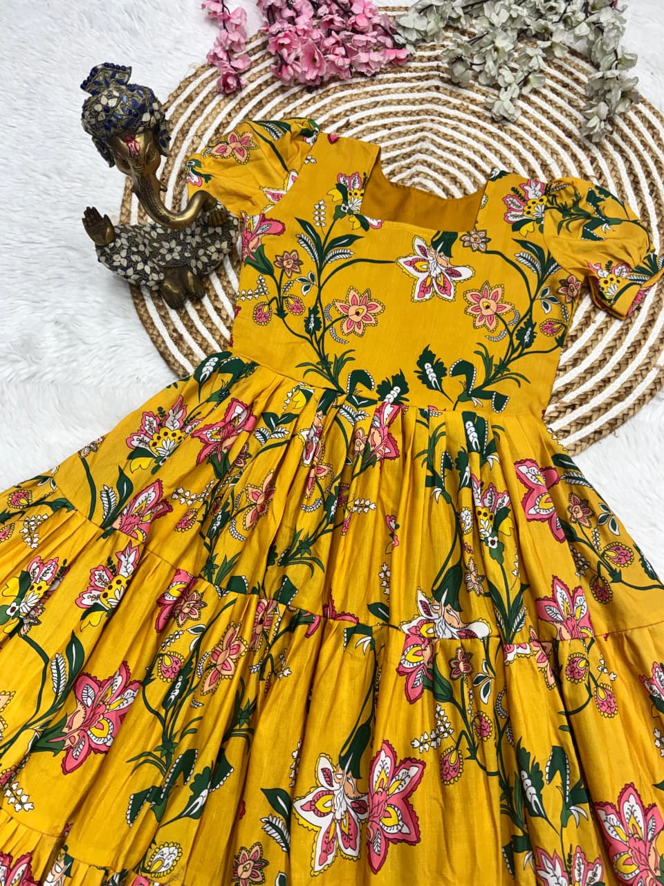 Flat lay of Sunshine Yellow Muslin Cotton floral printed 3 Layer maxi dress
