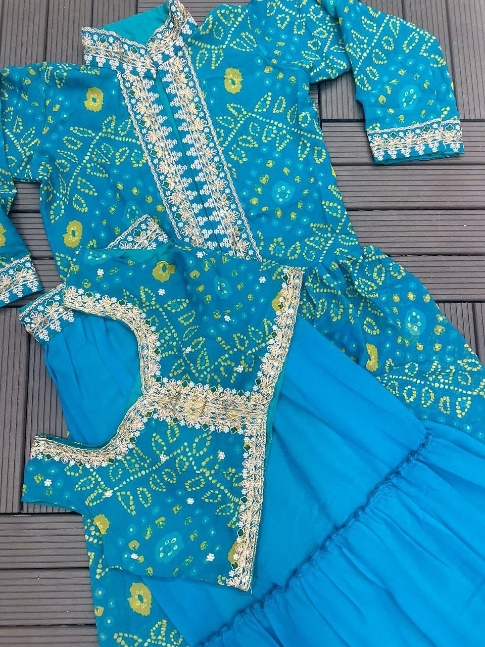 Complete Turquoise Blue shrug lehenga set with blouse shrug and lehenga flat lay