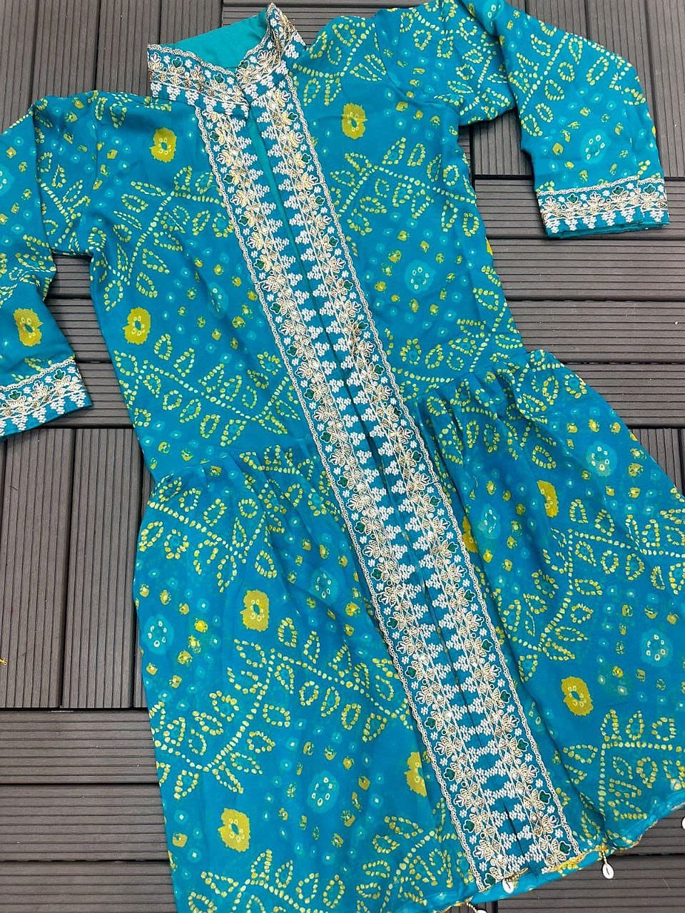 Turquoise Blue shrug lehenga set flat lay with embroidered shrug and blouse