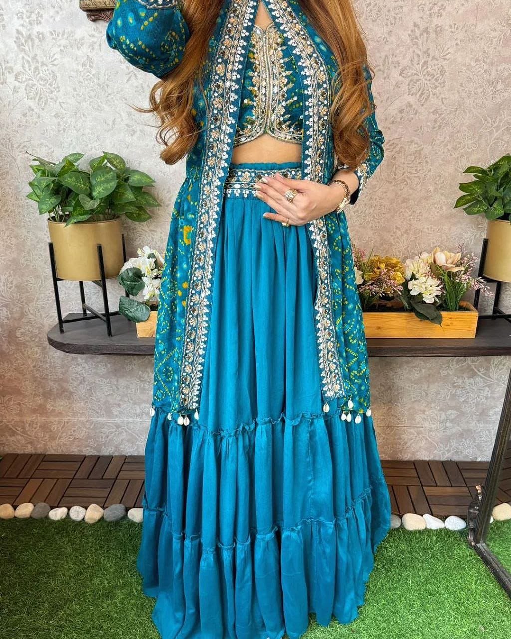 Model wearing Turquoise Blue shrug lehenga set with embroidered long shrug