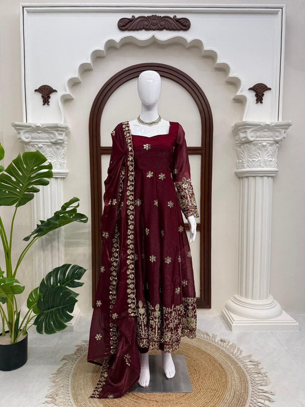 Wine Burgundy embroidered Fendy silk Anarkali suit with matching dupatta on mannequin