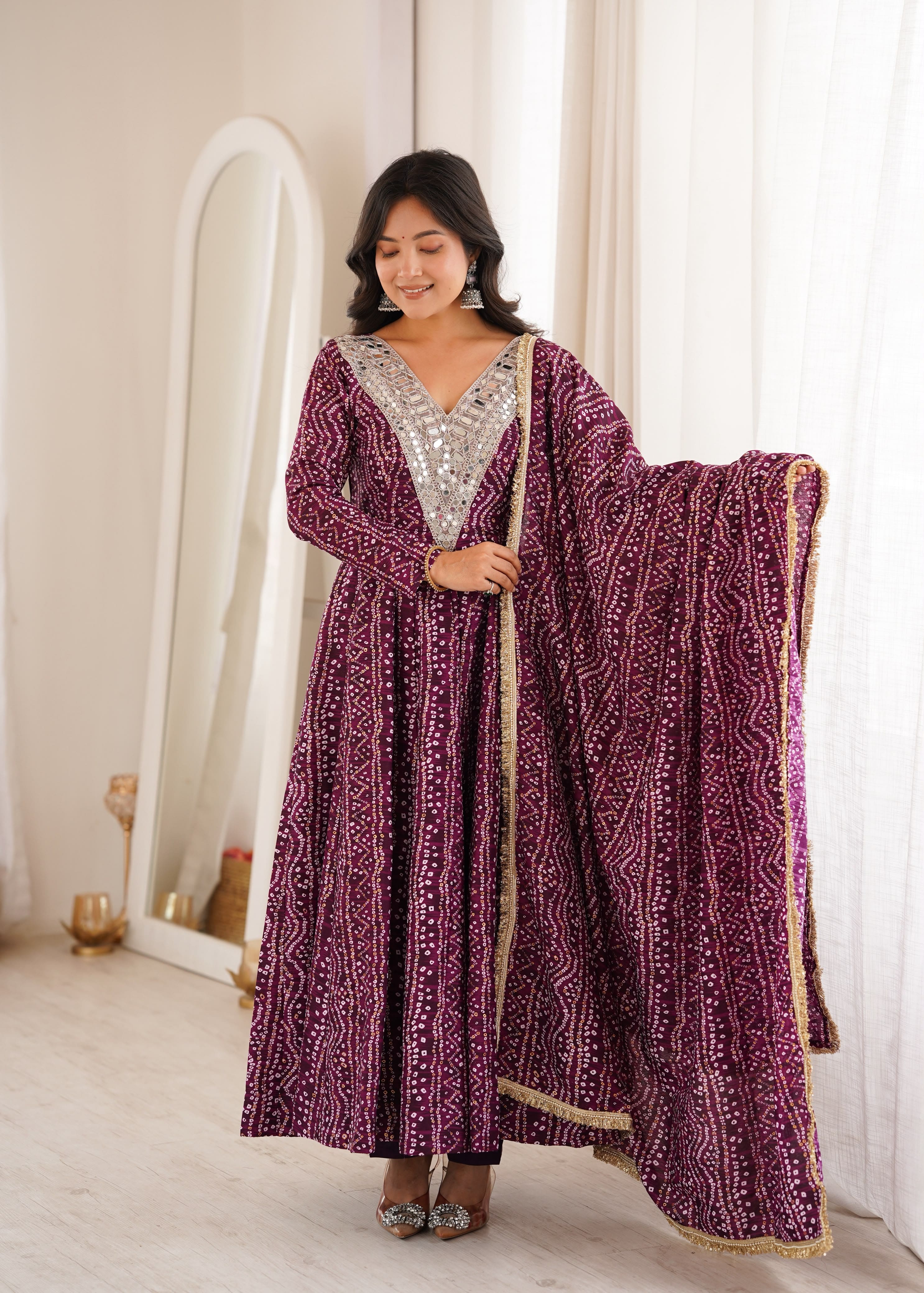 Woman wearing Wine Purple mirror embroidery gown with dupatta
